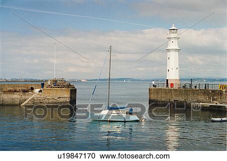 Stock Image - lighthouse located at NewHavenHarbour, Scotland. Fotosearch