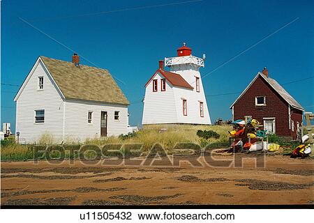 Stock Image - lighthouse located at NorthRustico, PEI. Fotosearch