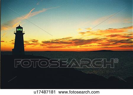 Stock Image - lighthouse located at Peggys Point, Nova Scotia. Fotosearch
