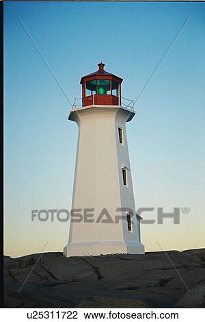 Stock Image - lighthouse located at Peggys Point, Nova Scotia. Fotosearch