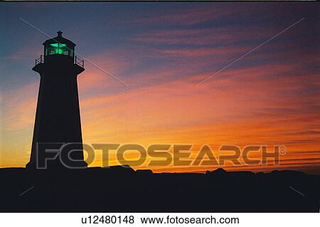Stock Photo - lighthouse located at Peggys Point, Nova Scotia. Fotosearch