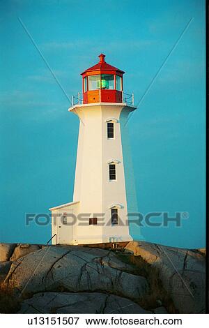 Stock Photo - lighthouse located at Peggys Point, Nova Scotia. Fotosearch