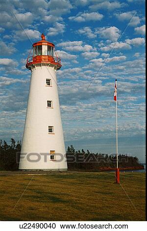 Stock Image - lighthouse located at Point Primm, PEI. Fotosearch