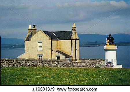 Stock Photo - lighthouse located at PortCharlotte, Scotland. Fotosearch