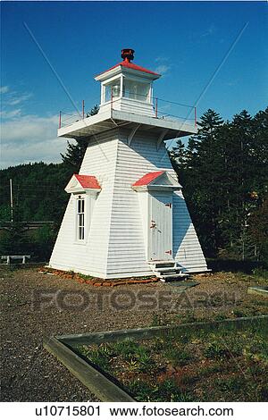 Stock Image - lighthouse located at PortGreville, Nova Scotia. Fotosearch
