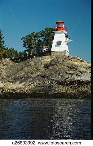 Stock Image - lighthouse located at Portlock Point, British Columbia, Canada. Fotosearch