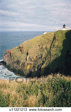Stock Image - lighthouse located at St. AbbsHead, Scotland. Fotosearch