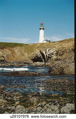 lighthouse located at YaquinaHead, Oregon, United States View Large Photo Image Stock Photograph - lighthouse located at YaquinaHead, Oregon, United States. Fotosearch