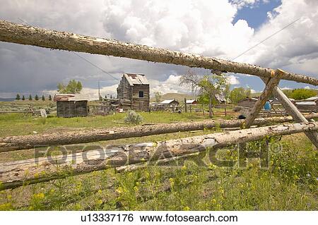 Deserted log buildings with old fence View Large Photo Image Stock Photograph - Deserted log buildings with old fence. Fotosearch