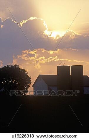 Silhouette of farm buildings with dramatic sky View Large Photo Image Stock Photo - Silhouette of farm buildings with dramatic sky. Fotosearch