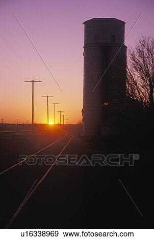 Stock Photo - Silo Silhouetted at Sunset . Fotosearch