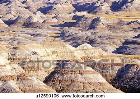Stock Photograph - Badlands National Park at sunset, South Dakota. Fotosearch