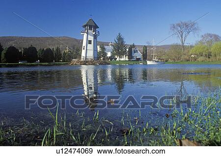 Stock Photo - Lighthouse and harbor. Fotosearch