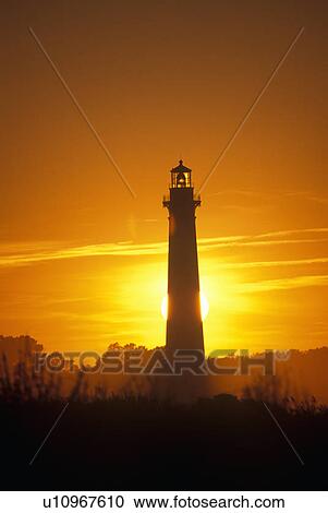 Stock Image - Lighthouse in the sunset. Fotosearch