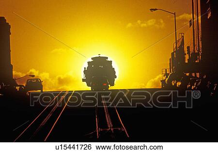 Stock Photograph - Sunset on a San Francisco cable car. Fotosearch