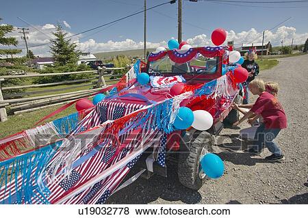 Boys Decorating A Car In Red White Blue Stock Photo
