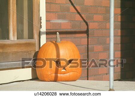 Carved Pumpkin Sitting on Stoop View Large Photo Image Stock Photo - Carved Pumpkin Sitting on Stoop. Fotosearch