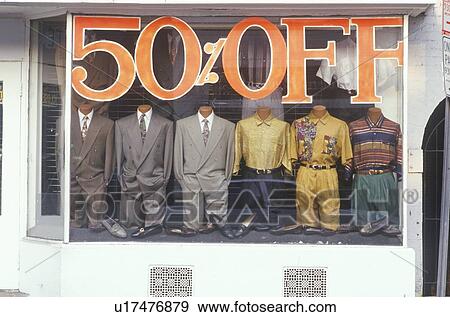 Discounted men's clothes in storefront window View Large Photo Image Stock Photo - Discounted men's clothes in storefront window. Fotosearch