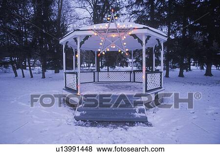 Stock Photo - Gazebo with lights on in fresh snow at Christmas time. Fotosearch