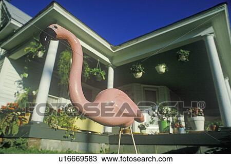Stock Image - Pink Flamingo yard ornament. Fotosearch