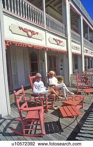 Rocking chairs on porch of Victorian home View Large Photo Image Stock Image - Rocking chairs on porch of Victorian home. Fotosearch