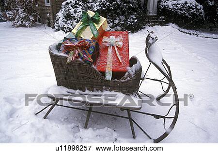 Sleigh With Presents on Lawn View Large Photo Image Stock Photo - Sleigh With Presents on Lawn. Fotosearch