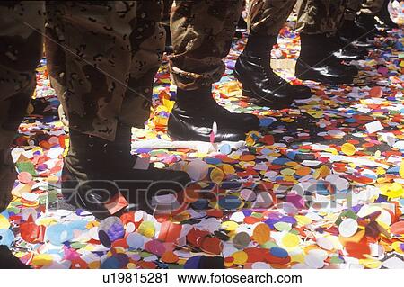 Stock Image - Soldiers' Boots Standing in Confetti. Fotosearch