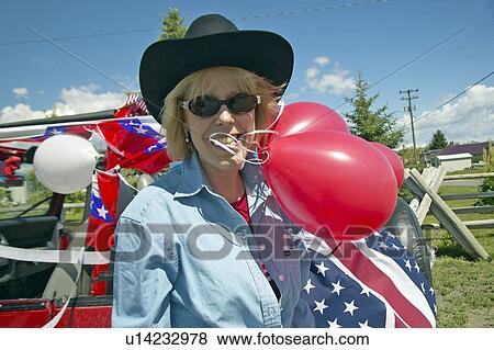 Woman with balloons and decorated red, white and blue car View Large Photo Image Stock Photo - Woman with balloons and decorated red, white and blue car . Fotosearch