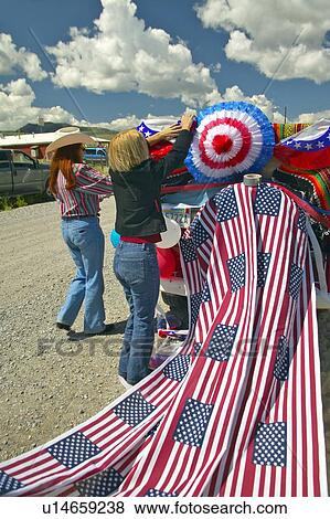 Women decorating a car in red, white & blue View Large Photo Image Stock Photo - Women decorating a car in red, white & blue. Fotosearch