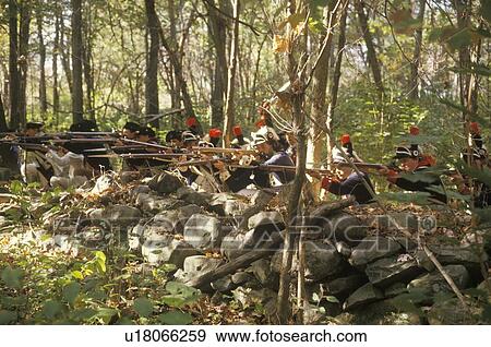 Stock Photo - American soldiers during Historical American Revolutionary War Reenactment. Fotosearch