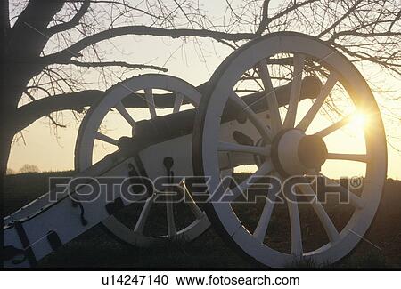 Stock Image - Cannons at the Revolutionary War National Park at sunrise. Fotosearch