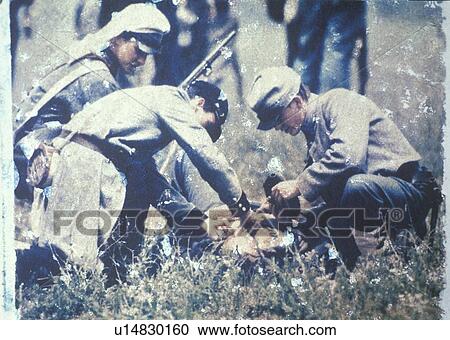 Stock Image - Soldiers tending wounded during Civil War Reenactment of Battle of Bull Run. Fotosearch