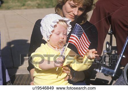Mother and Baby Holding American Flag View Large Photo Image Stock Photo - Mother and Baby Holding American Flag. Fotosearch