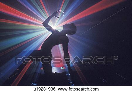 Stock Photograph - Dancer with Laser lights. Fotosearch