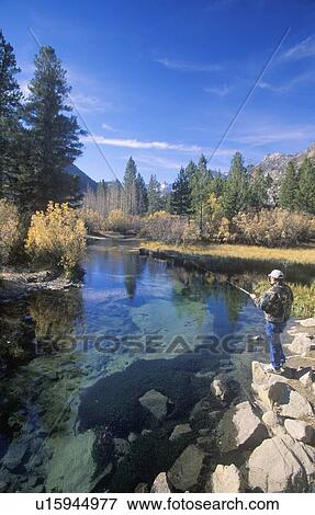 Scenic of fisherman in mountains View Large Photo Image Stock Photo - Scenic of fisherman in mountains. Fotosearch