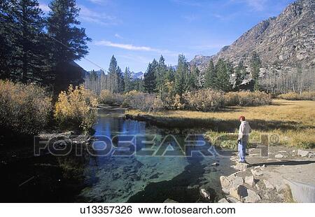 Scenic of fisherman in mountains View Large Photo Image Stock Photograph - Scenic of fisherman in mountains. Fotosearch