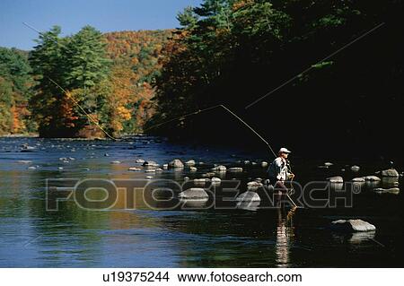 Solitary fly fisherman View Large Photo Image Picture - Solitary fly fisherman. Fotosearch