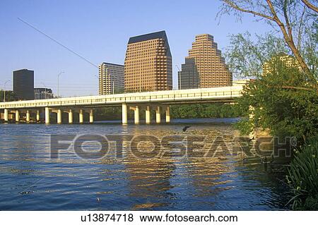 Stock Photo - Skyline of Austin, TX, state capitol with Colorado River in foreground. Fotosearch
