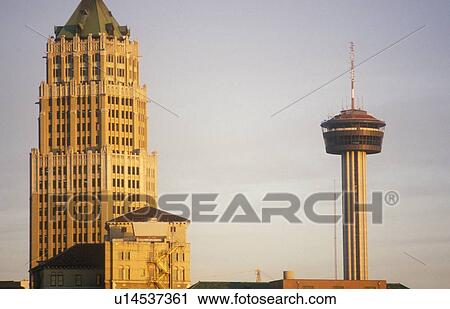 Stock Image - Skyline of historical San Antonio, TX at sunset. Fotosearch