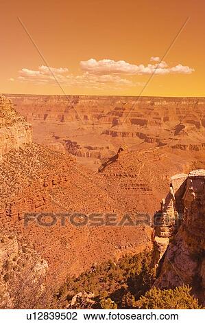 Stock Image - Edge of South Rim of Grand Canyon National Park. Fotosearch