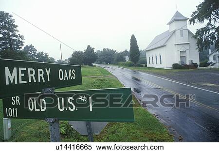 Stock Photography - Route 1 in rain with church in background. Fotosearch