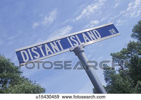 Stock Photo - A sign that reads “Distant Island Dr”. Fotosearch