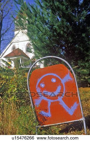 Stock Photograph - Sign with happy cartoon character at Nursery School in Autumn in Catskills, NY. Fotosearch