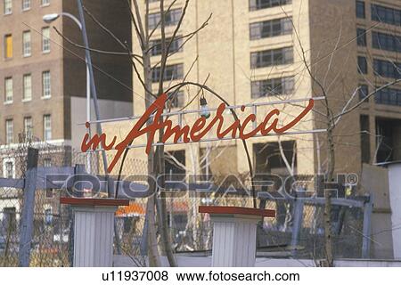 A sign that reads “in America” View Large Photo Image Stock Photo - A sign that reads “in America”. Fotosearch