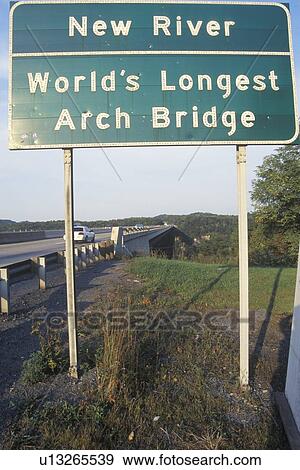 A sign that reads “New River - World's Longest Arch Bridge” View Large Photo Image Stock Photo - A sign that reads “New River - World's Longest Arch Bridge”. Fotosearch