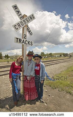 Three women at a railroad crossing dressed for the Fourth of July View Large Photo Image Stock Image - Three women at a railroad crossing dressed for the Fourth of July. Fotosearch