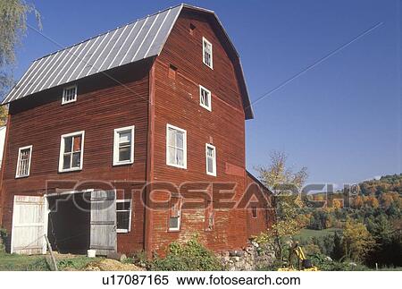 Stock Photography - A three story red barn in autumn . Fotosearch