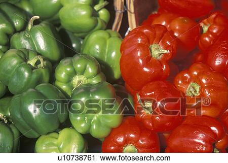 Stock Image - Green and red peppers in baskets. Fotosearch