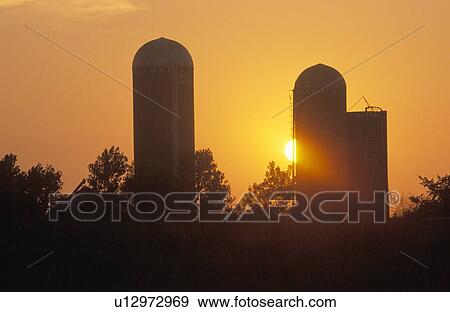 Stock Photo - Midwestern sunset on a rural farm. Fotosearch