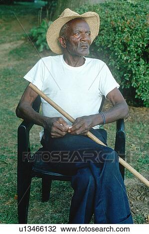 Stock Image - An 86-year old African-American man sitting in a chair. Fotosearch